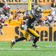 Pittsburgh wide receiver Antonio Brown flees a defender in Sunday's game against the Buccaneers. (Photo: Pittsburgh Steelers)